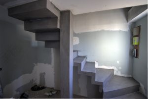 Escalier quart tournant entièremen,t recouvert de Béton Ciré